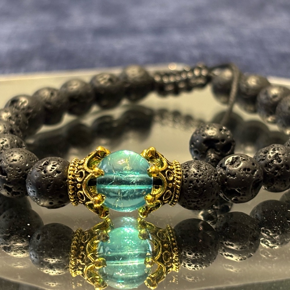 Black and Gold Bracelet with Turquoise Centerpiece and Decorative Accents